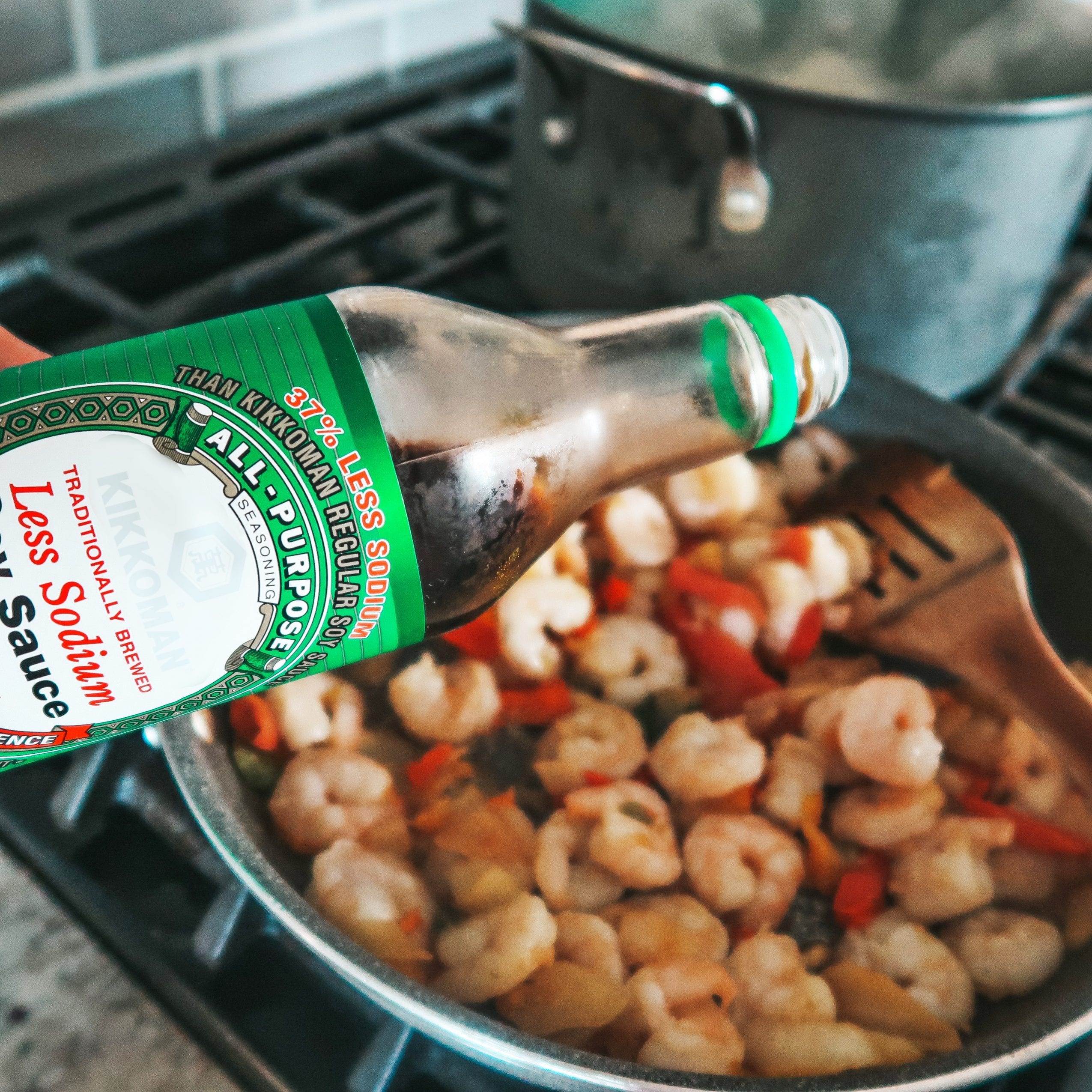 Adding soy sauce to cooked shrimp and veggies (2)