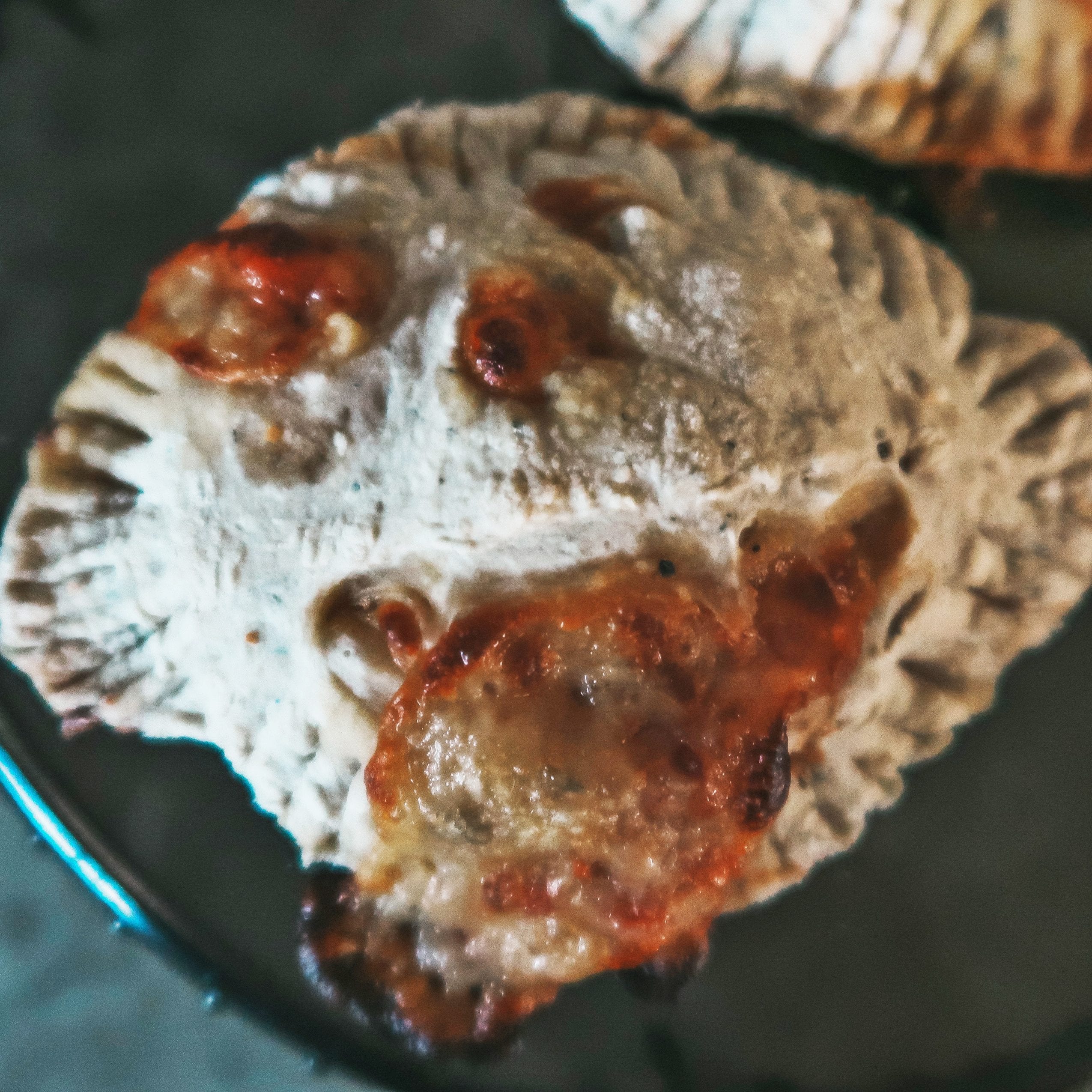 Cheesy-faced pumpkin pizza calzone