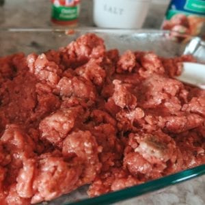 Mixing egg into hamburger meat