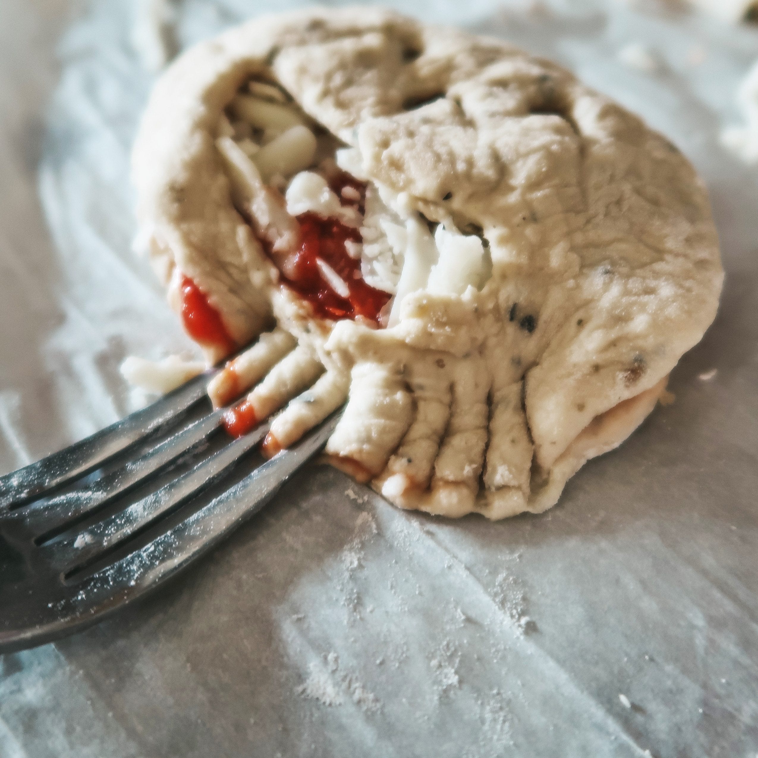 using a fork to crimp the calzone closed