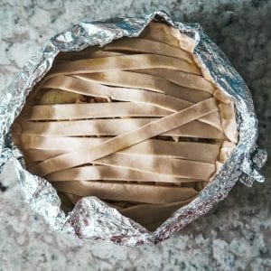 adding the foil to protect pie edges