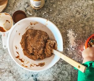Mixing the peanut butter, melted butter, and powdered sugar