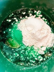 adding dry ingredients with wet for play dough