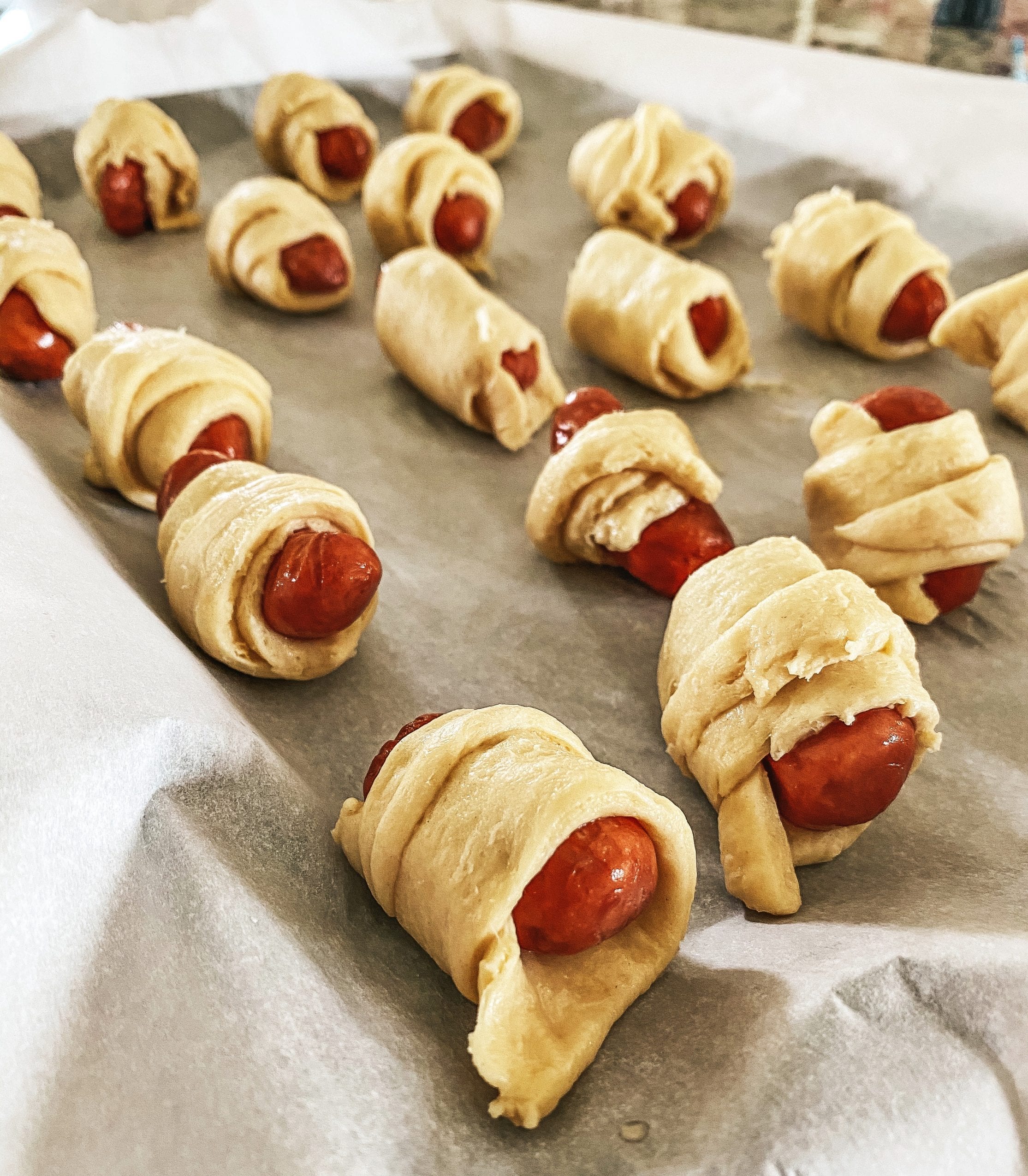 Pigs in a blanket ready to be baked