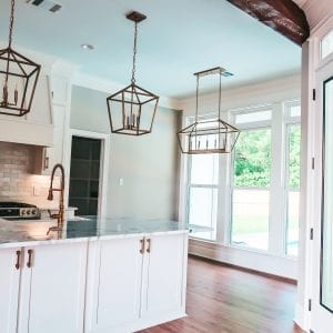 kitchen with white cabinets and gold fixtures
