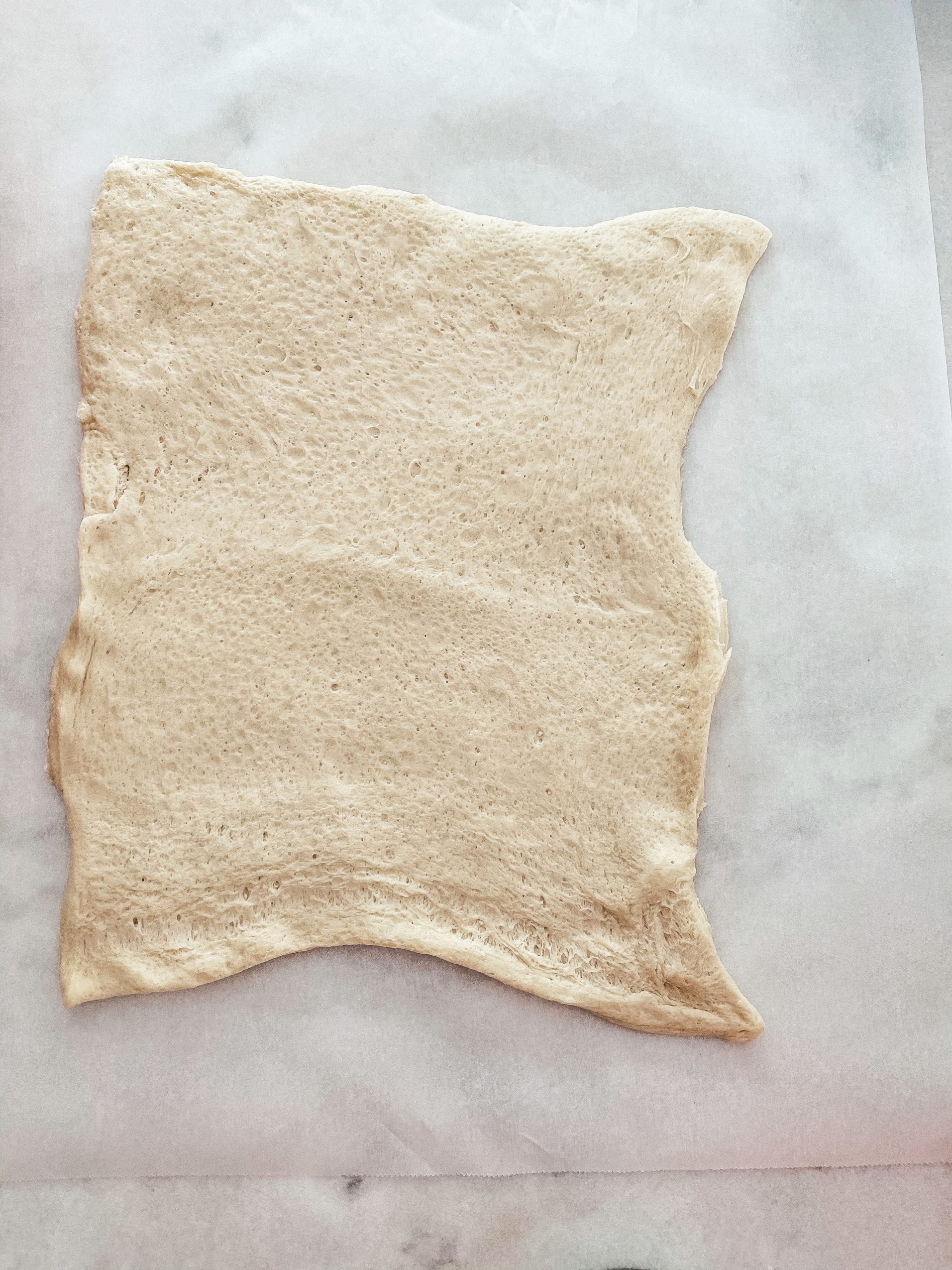 rolling out the pillsbury pizza dough