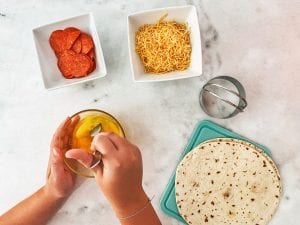 adding cheese to egg mixture