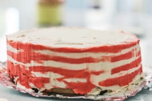 smoothing the stripes of the buttercream