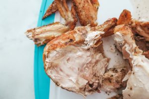 cutting the chicken off the bone