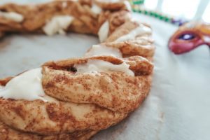 adding the filling to the king cake