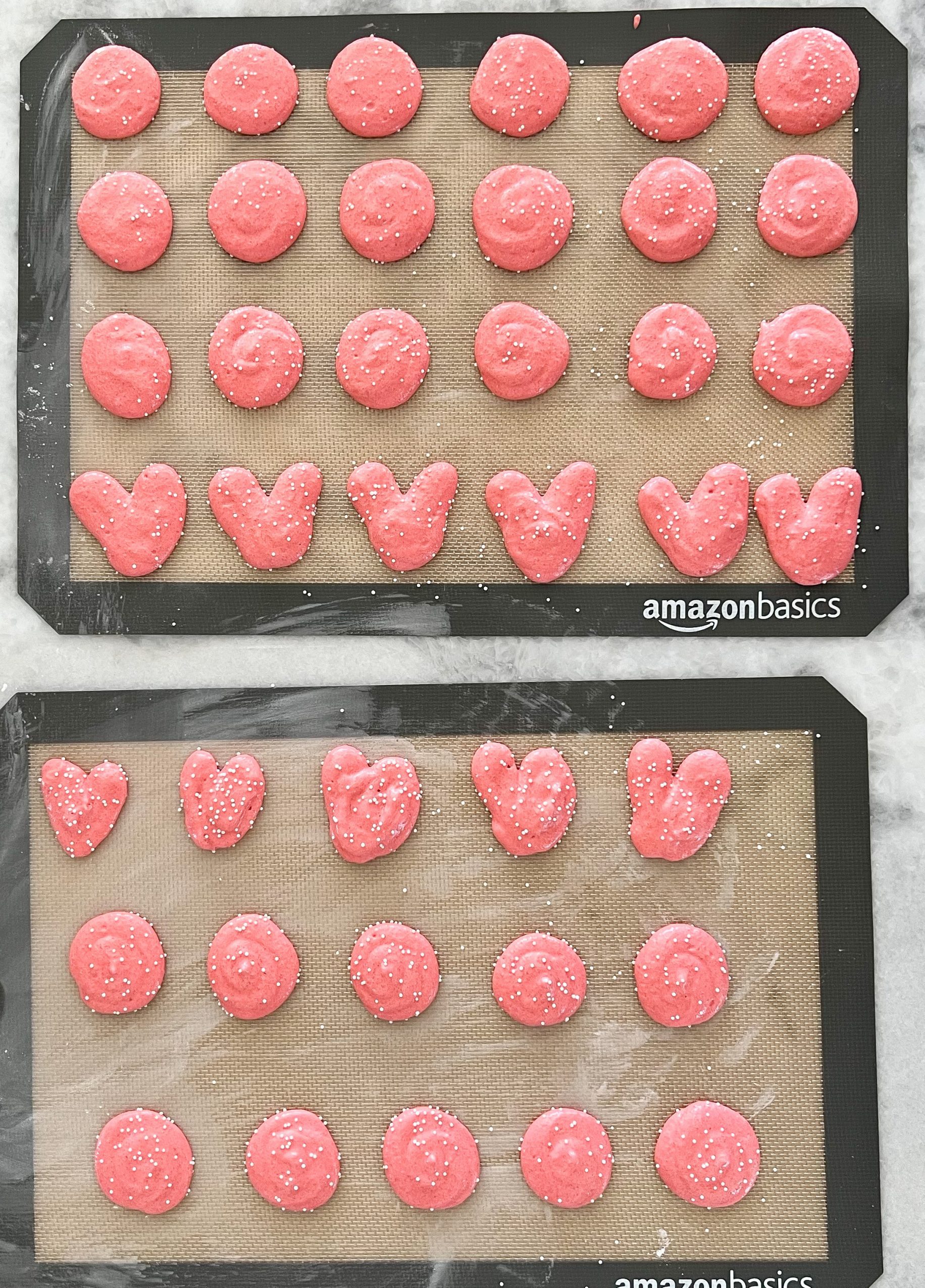 pink macarons setting before baking