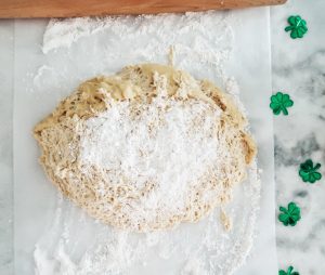 preparing the dough to roll out for beignets