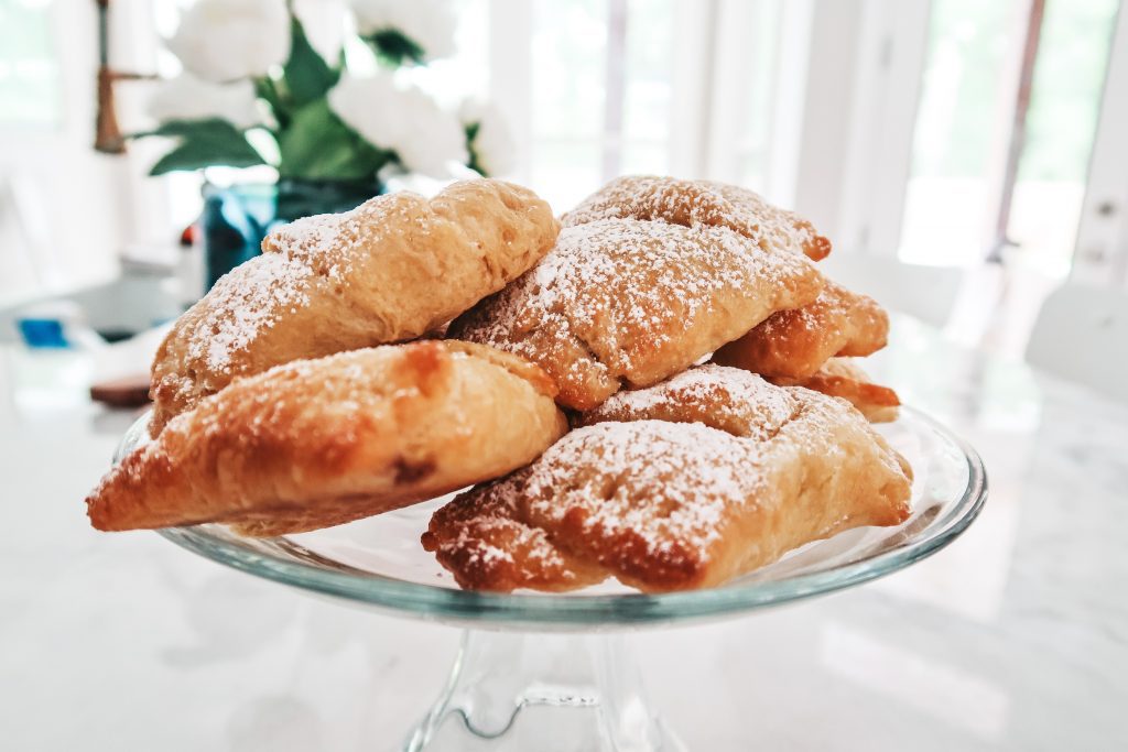 sprinkle the simple raspberry filled crescent rolls with powdered sugar