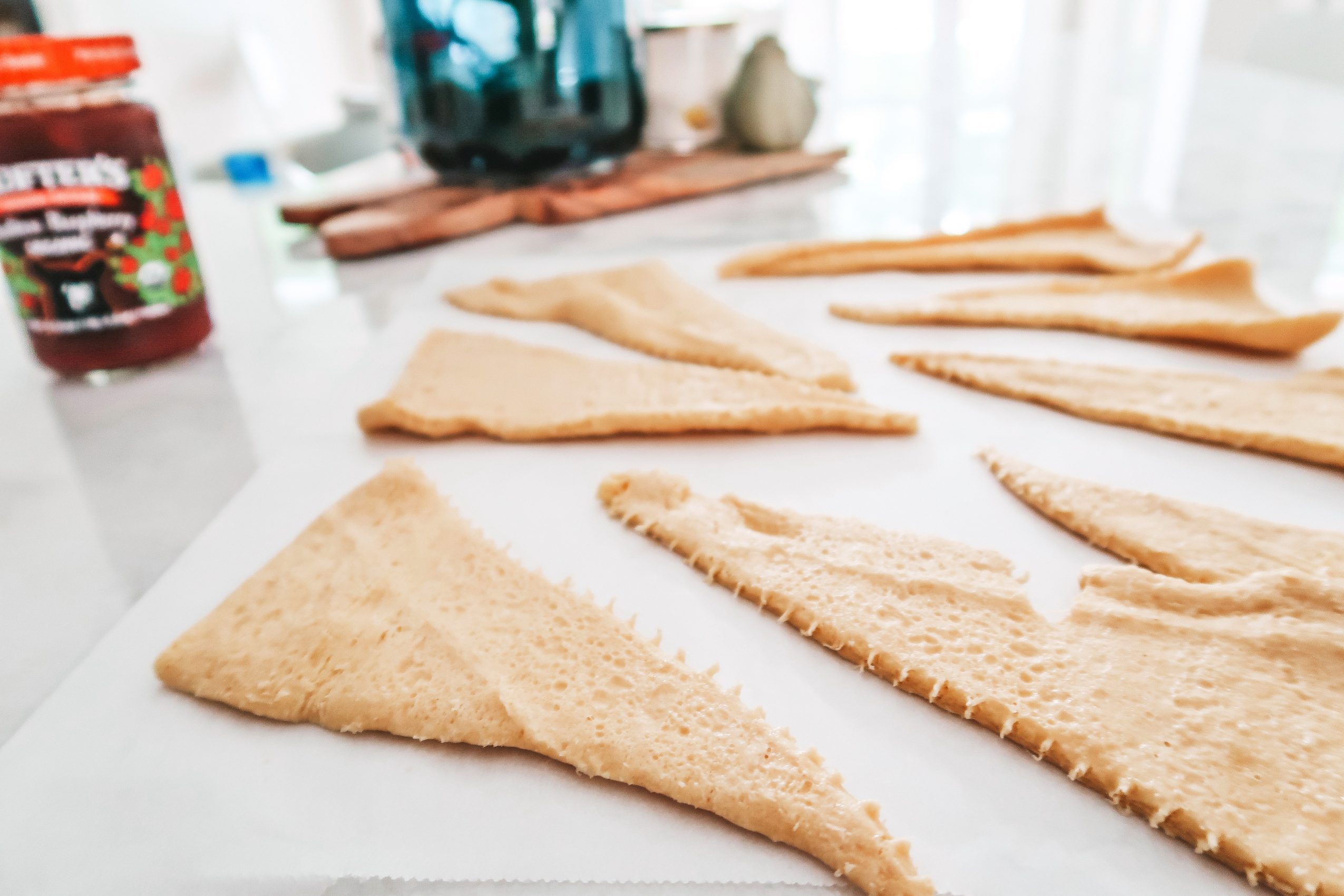 unroll the crescent rolls on a parchment lined cookie sheet