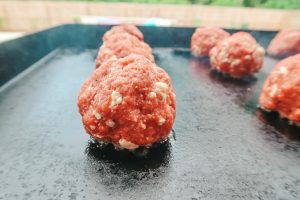place burger balls on a grill