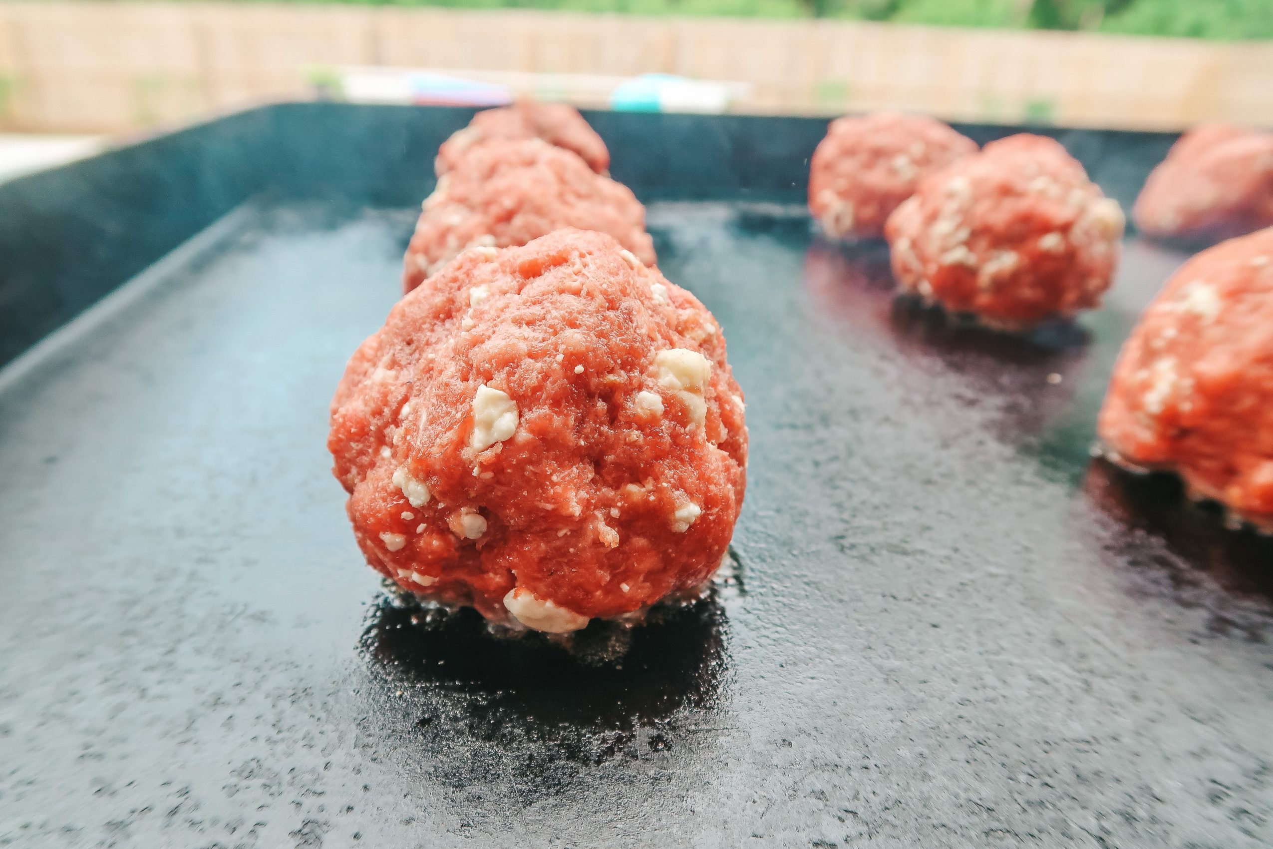 place burger balls on a grill