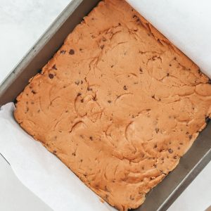 Pressing the protein bars into a 8x8 pan