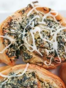 Baked simple creamy spinach and artichoke pinwheel pastries