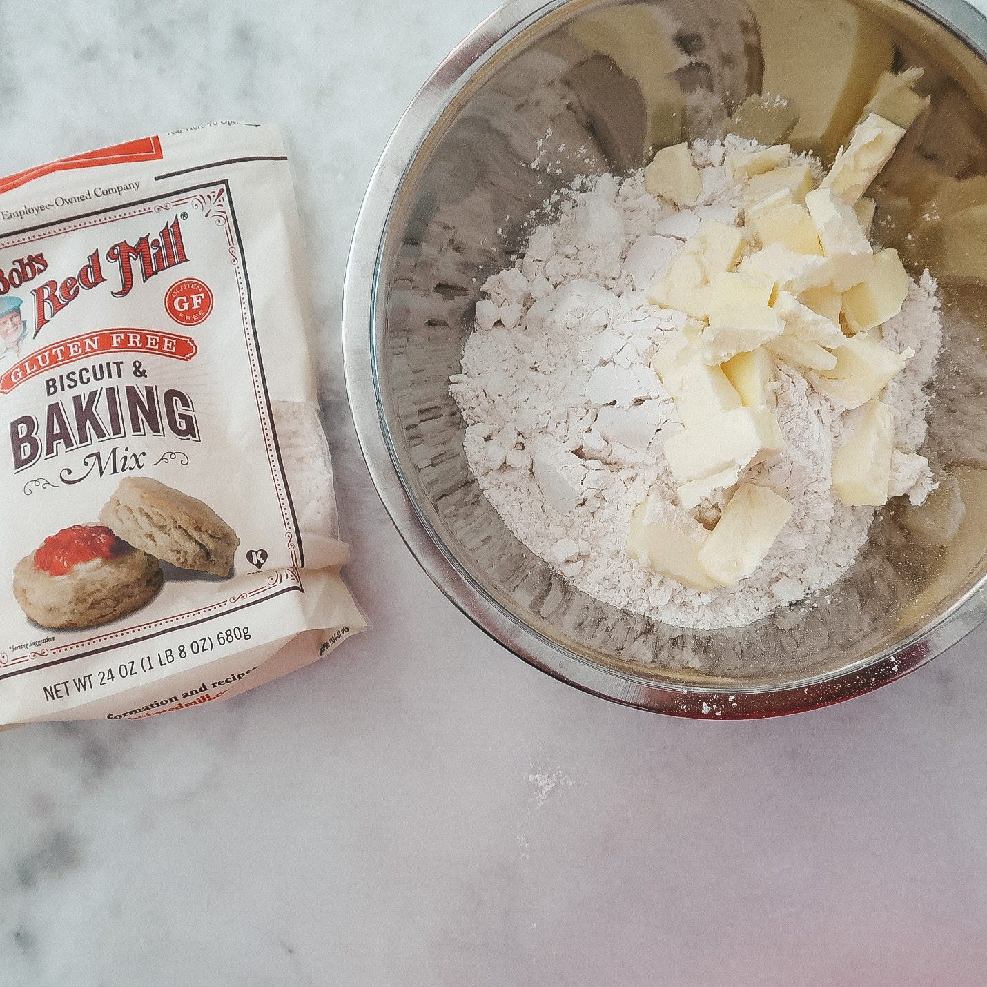 adding chilled cubed butter to Bob's Red Mill Gluten Free biscuit and baking mix