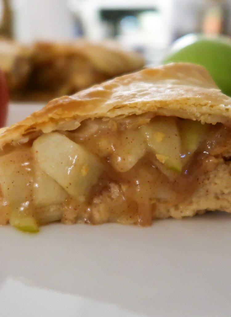 slice of the delicious and easy stuffed apple pie cheesecake