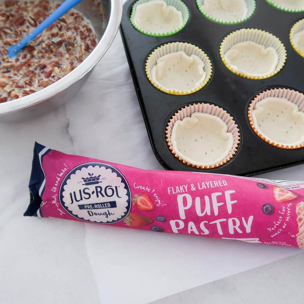 Adding the Jus-Rol Puff Pastries to the muffin cups