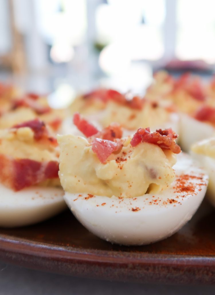 Deviled eggs topped with bacon crumbles
