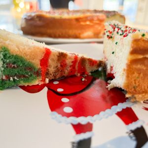 a cheesecake with a Christmas sugar cookie crust