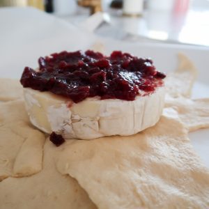 brie with raspberry preserves on top