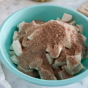 cinnamon and sugars mixture on top of biscuits for easy 4 ingredient monkey bread