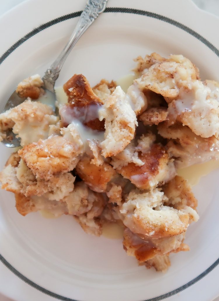 An easy overnight donut bread pudding with white chocolate glaze