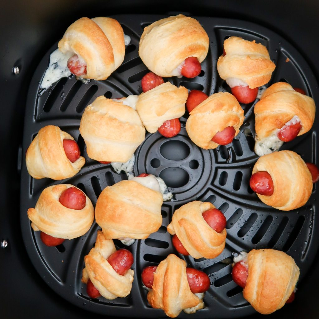 cooking the pigs in a blanket in an air fryer