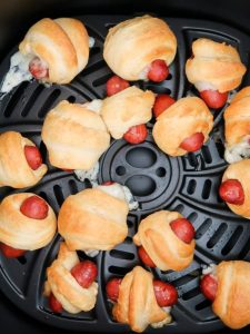 cooking the pigs in a blanket in an air fryer