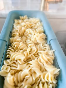 draining fusilloni pasta