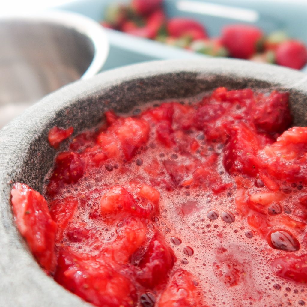 smushed up strawberries for simple fresh strawberry pie
