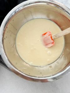 Melting the butter, white chocolate chips, condensed milk