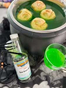 Shrunken apple heads in witches brew